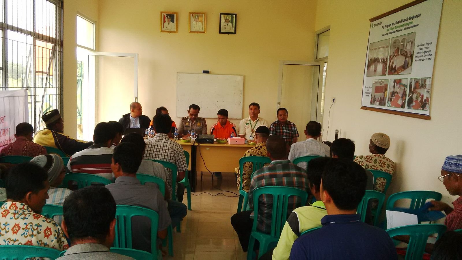 APRIL team discussing the Fire Free Village Program with the communities. 